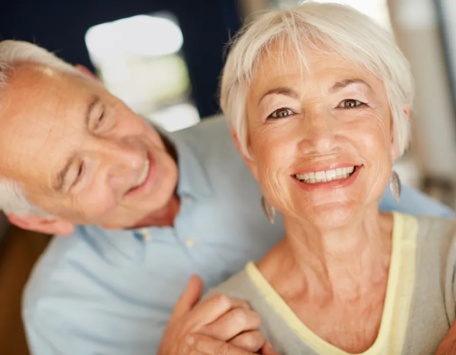 Smiling older couple, illustrating healthy aging, longevity, and performance